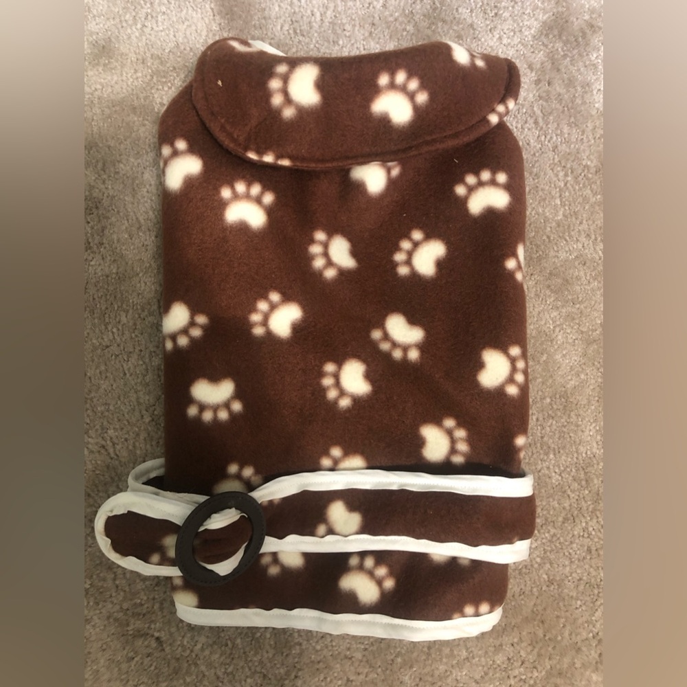 Fleece dog jacket w/adorable paw print pattern never been worn